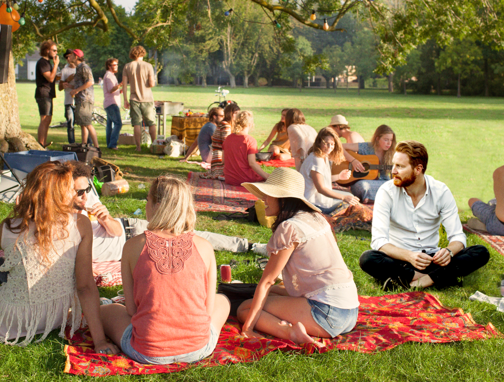 Man Who Didn’t Bring Picnic Blanket Sits Ashamedly On Ground Next To Everyone