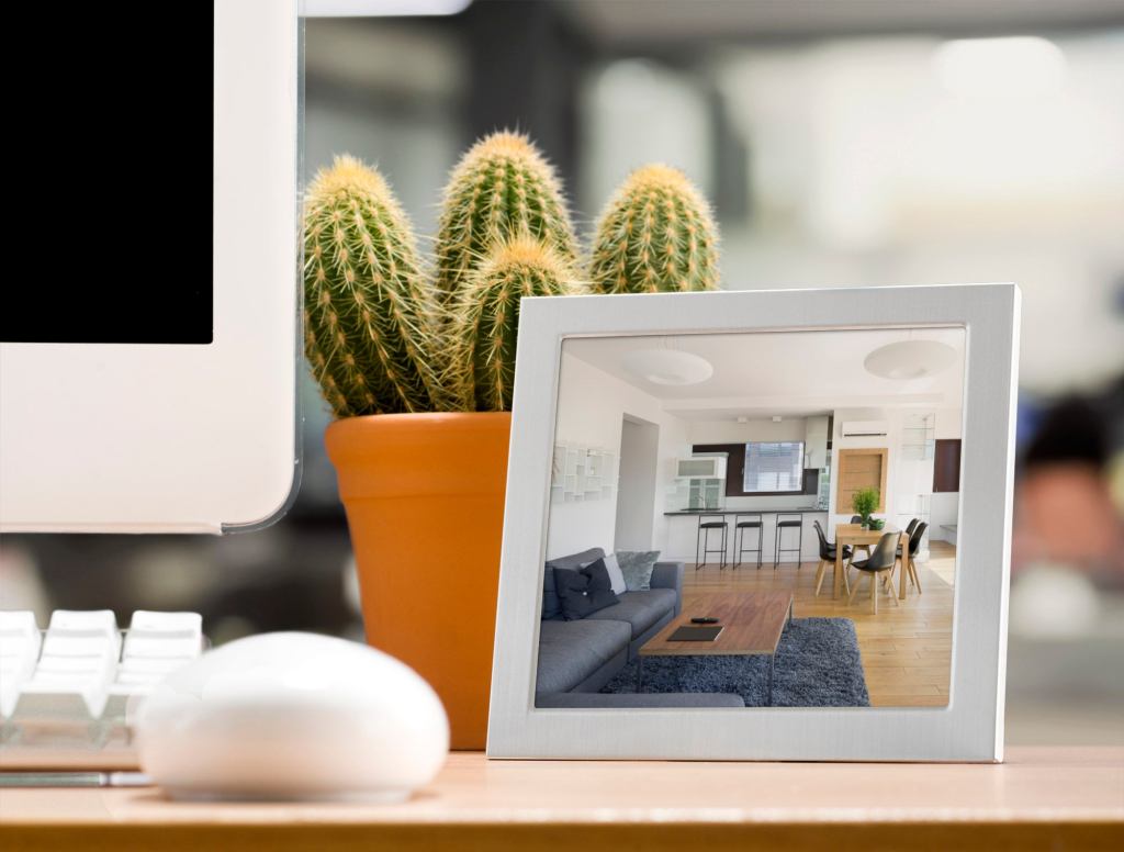 Worker Keeps Photo Of Empty Apartment On Desk To Remind Him Why He Stays Late