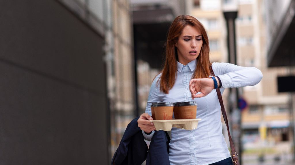 Study: Greatest Indicator Of Stress Blowing Hair Off Face While Carrying Complicated Coffee Order For Boss Across Bustling City Streets