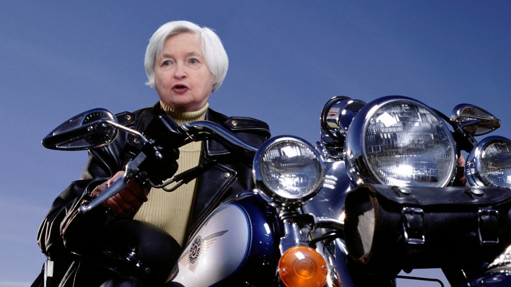 Motorcycle-Revving Janet Yellen Folds Up Picture Of Cryptocurrency Before Speeding Away