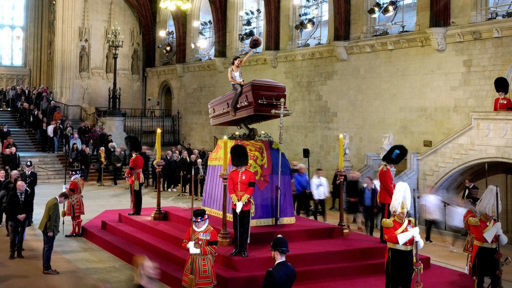 Brits Take Turns Mourning Atop Queen’s Bucking Casket