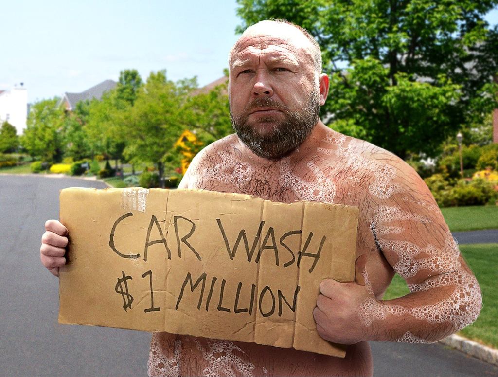 Shirtless Alex Jones Stands On Side Of Road Holding ‘Car Wash: $1 Million’ Sign