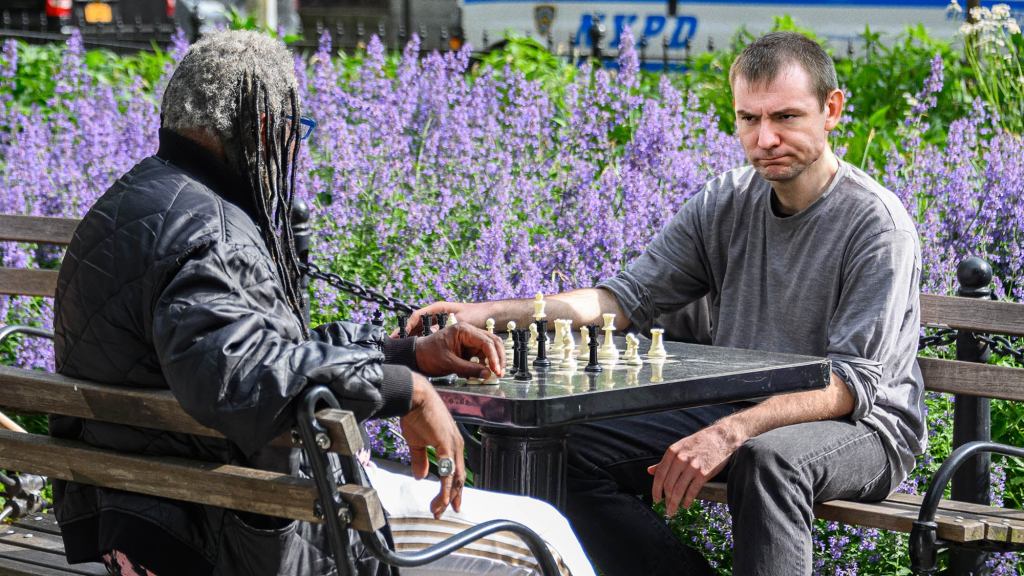 Man Starting To Suspect Chess Opponent With All Queens Hustling Him