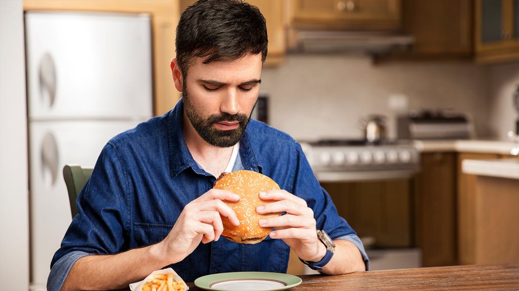 Man Inspects Perimeter To Find Most Vulnerable Entry Point To Hamburger