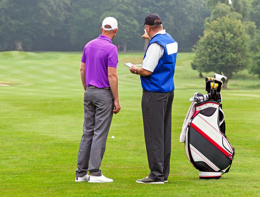 Caddy Helpfully Points Out Direction Of Hole