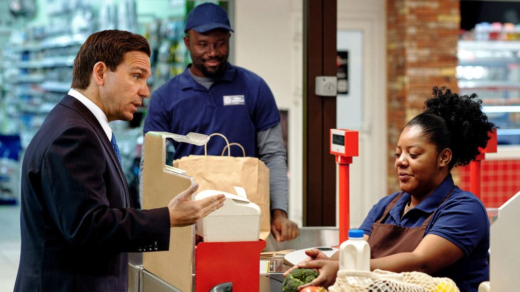 Ron DeSantis Flubs Grocery Store Visit By Attempting To Buy Cashier