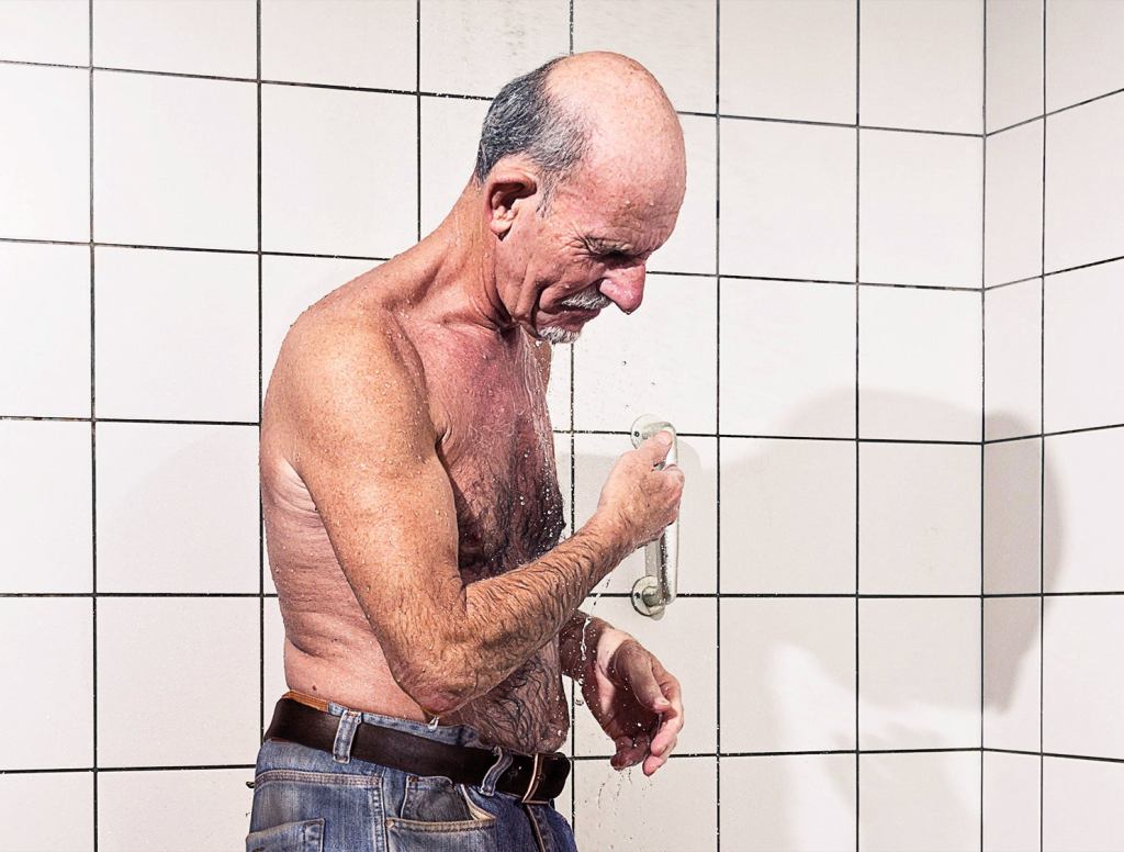 Eastern European Man In Gym Locker Room Showering With Jeans On