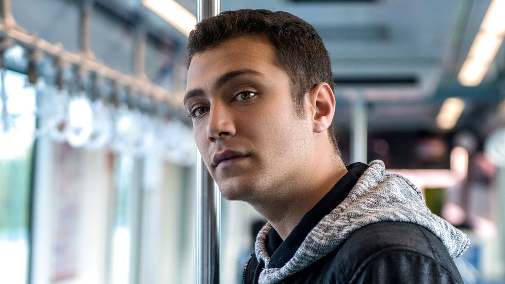 Man Searches Crowded Bus For Least-Wounded Person To Sit Next To