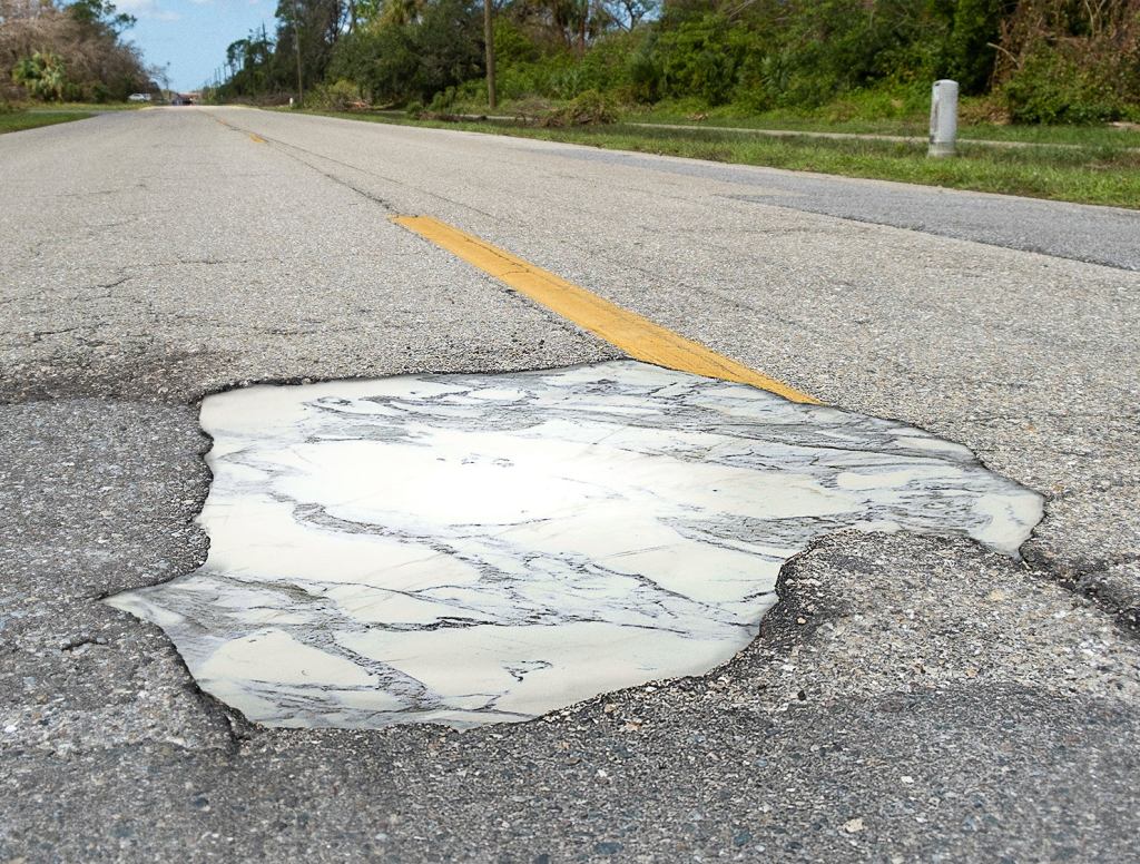 Potholes In Nice Part Of Town Filled With Italian Marble