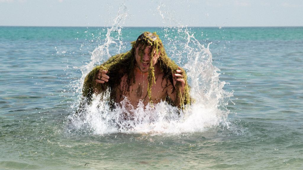 Naked Man Emerging From Ocean Must Have Just Finished Evolving