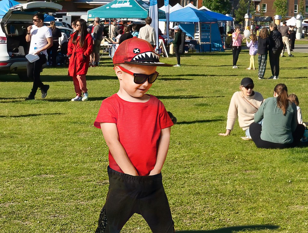 Child Standing With Both Arms Down Pants