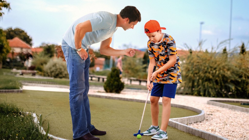 Dad Not Leaving This Mini Golf Hole Until Son Shows Him Some Good Form